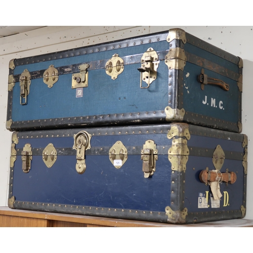 125 - A pair of 20th century metal bound travel trunks and a leather Gladstone style bag containing lawn b... 