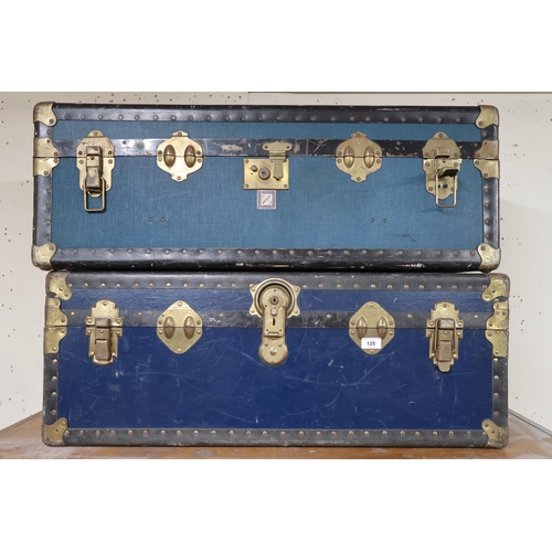 125 - A pair of 20th century metal bound travel trunks and a leather Gladstone style bag containing lawn b... 