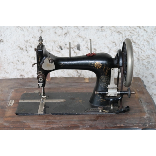 129 - A 20th century Pfaff cast iron based treadle sewing machine, 100cm high x 74cm wide x 43cm deep