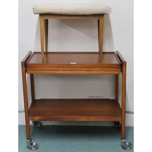 148 - A mid 20th century teak two tier tea trolley and an upholstered stool (2)