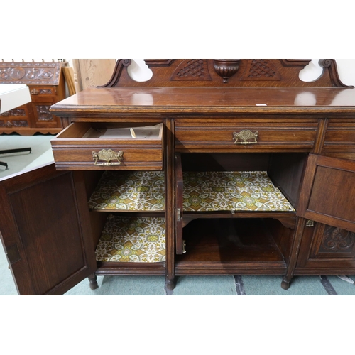 154 - A Victorian oak sideboard with three short drawers over pair of cabinet doors flanked by cabinet doo... 