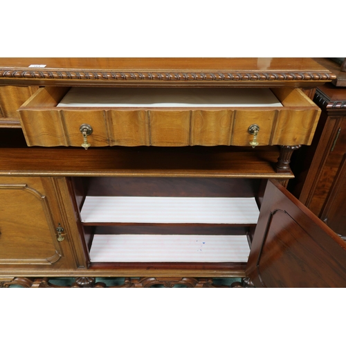 164 - A 20th century mahogany sideboard with two long drawers over pair of cabinet doors with a further do... 