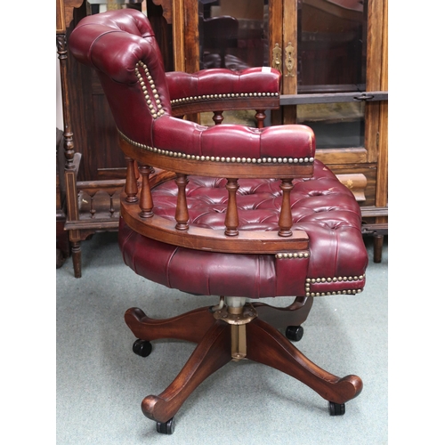 27 - A 20th century button back leather upholstered captain style swivel desk chair, 89cm high x 62cm wid... 