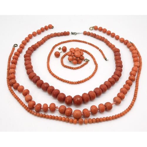 2837 - A COLLECTION OF CORAL JEWELSto include a string of faceted coral beads, the largest 14.5mm x 12.1mm,... 