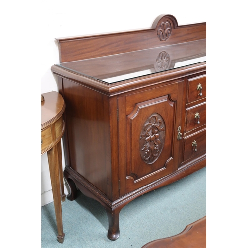 35 - A 20th century mahogany sideboard with three central drawers flanked by cabinet doors on cabriole fe... 