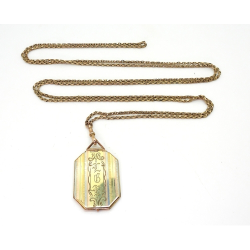 2848 - A 9CT GOLD GUARD CHAIN & LOCKETthe guard chain has attached tag stamped 9c, and stamped 9ct to t... 