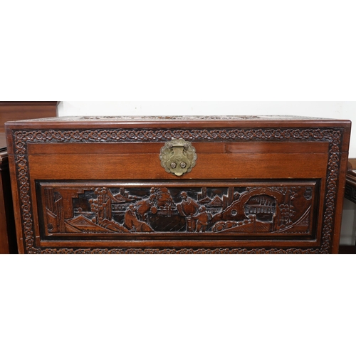 36 - A 20th century Chinese camphorwood chest with hinged top over four short over one long drawer all ex... 