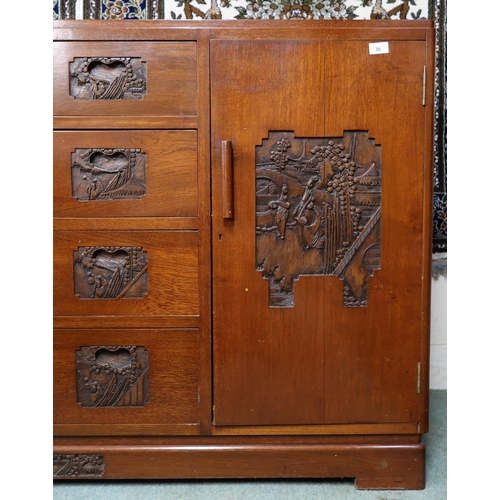 38 - A 20th century Oriental hardwood sideboard with four central drawers flanked by cabinet doors on pli... 