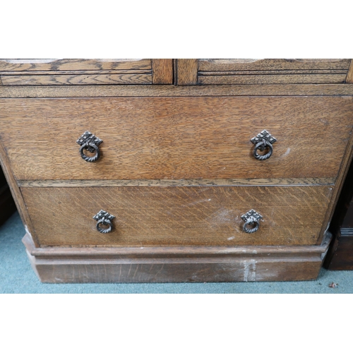 51 - A 20th century AY Crown Furniture oak gents tall boy with pair of panel doors over two long drawers ... 