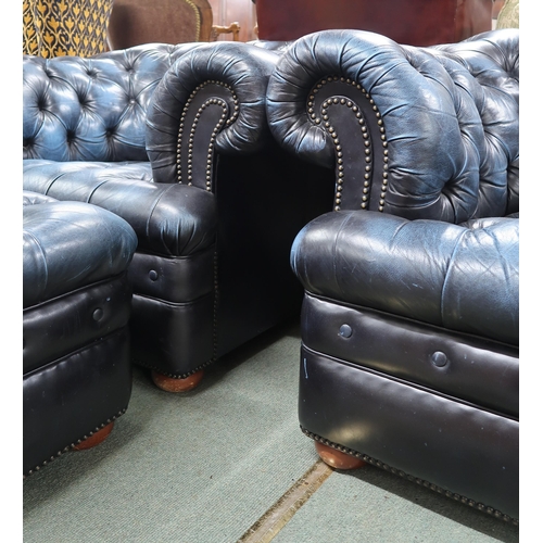 53 - A 20th century blue leather Chesterfield style three piece suite consisting three seater club settee... 