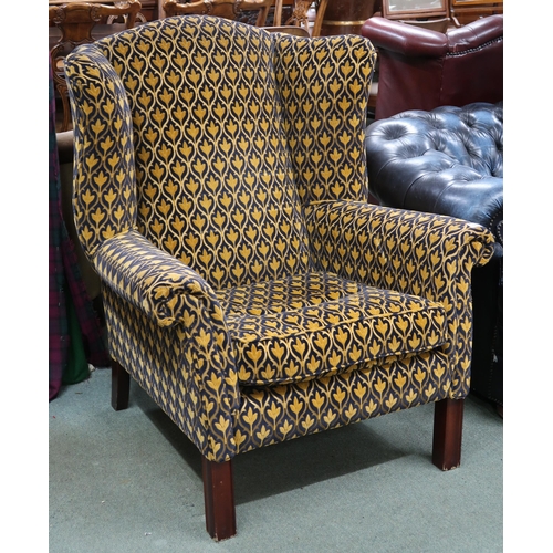 54 - A large 20th century Georgian style open armchair with foliate upholstery on square supports, 110cm ... 