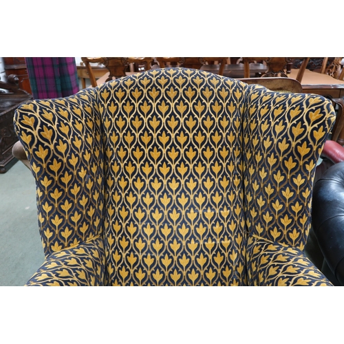 54 - A large 20th century Georgian style open armchair with foliate upholstery on square supports, 110cm ... 