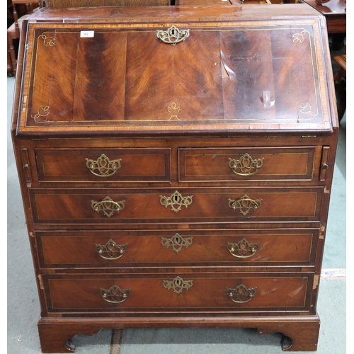 62 - A 19th century walnut veneered writing bureau with fall front fitted writing compartment over two sh... 