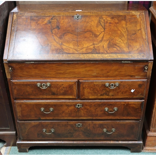 63 - A 19th century oak and walnut veneered writing bureau with fitted fall front writing compartment ove... 