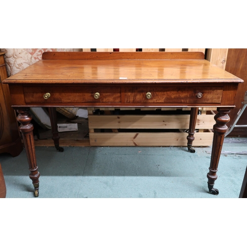 70 - A Victorian mahogany two drawer hall table on turned supports terminating in brass casters, 80cm hig... 