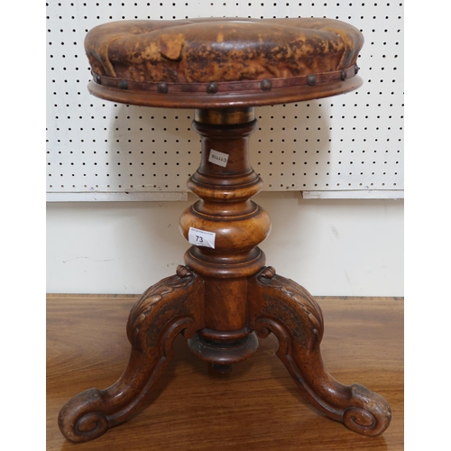 73 - A Victorian walnut adjustable stool with hide upholstered seat on tripod base, two copper bed warmin... 