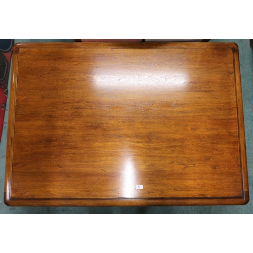 75 - A 20th century mahogany coffee table with rectangular top on hairy paw feet joined by carved friezes... 