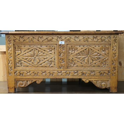 86 - A 20th century oak Jacobean blanket chest with extensive carvings to top front and sides, 47cm high ... 