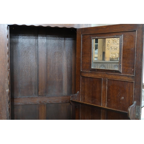 88 - A 20th century oak single door hall robe, 183cm high x 84cm wide x 42cm deep