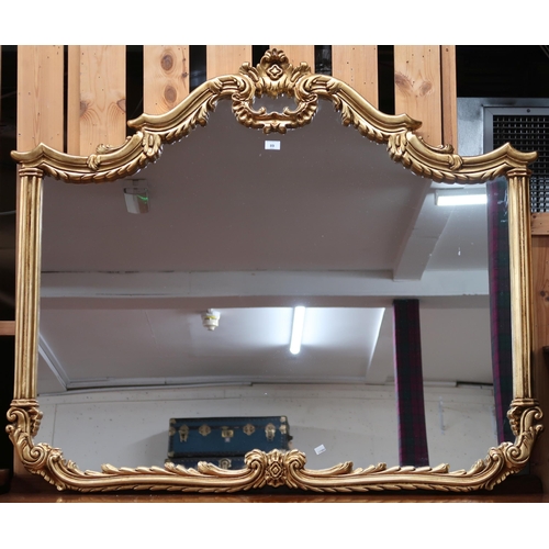 89 - A 20th century gilt framed Rococo style overmantle wall mirror, 114cm high x 135cm wide and a pair o... 