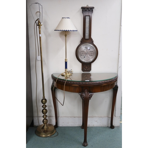 90 - A 20th century walnut veneered demilune fold over table, oak barometer thermometer, brass standard l... 