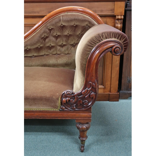 92 - A Victorian mahogany chaise longue with velvet upholstery on turned supports terminating in ceramic ... 