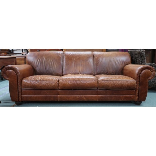 94 - A contemporary Italian leather upholstered three seater sofa on turn feet, 85cm high x 233cm wide x ... 