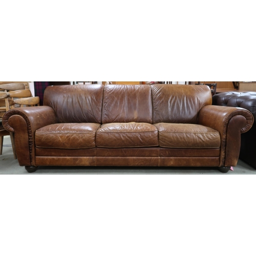 95 - A contemporary Italian leather upholstered three seater sofa on turn feet, 85cm high x 233cm wide x ... 