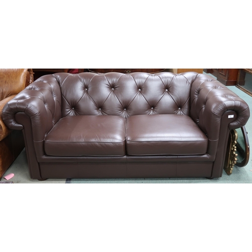 96 - A contemporary brown leather button back upholstered club style two seater sofa, 73cm high x 185cm w... 