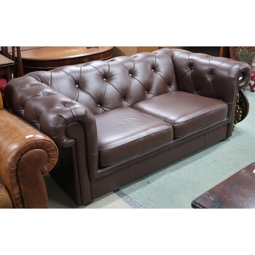 96 - A contemporary brown leather button back upholstered club style two seater sofa, 73cm high x 185cm w... 