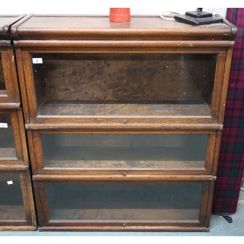 99 - An early 20th century Globe Wernicke three tier sectional bookcase with glazed fall front doors, 103... 