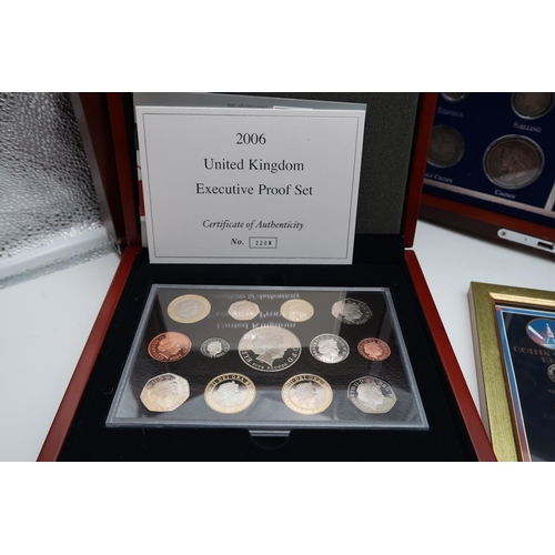 423A - VICTORIA & ELIZABETH II Coin set in wood display case and other commemorative coin sets  compris... 