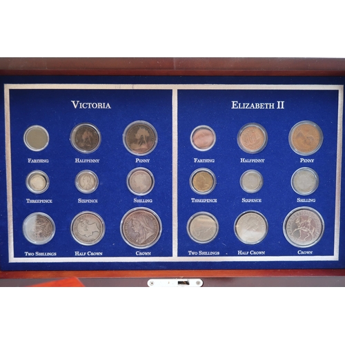 423A - VICTORIA & ELIZABETH II Coin set in wood display case and other commemorative coin sets  compris... 
