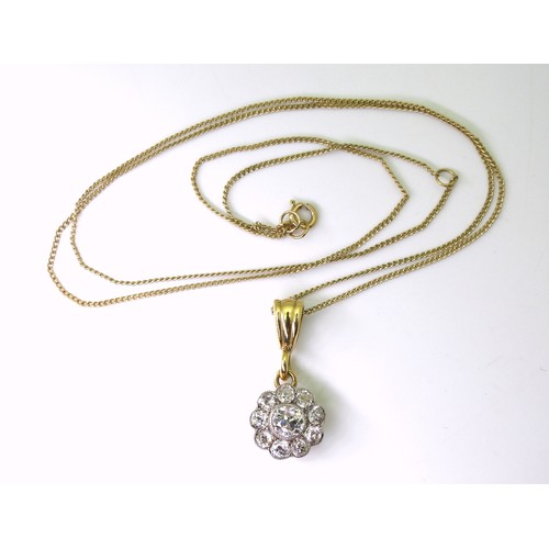 2849 - A DIAMOND FLOWER PENDANTin 14k gold mount, set with estimated approx 0.55cts of old cut diamonds, th... 