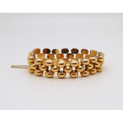 2854 - A FANCY GOLD BRACELETwith bobble pattern links and a hidden clasp, length 18.3cm, weight 43gms... 