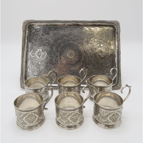 2487 - A PERSIAN SILVER TRAYof rectangular form, finely engraved with scrolling foliate decoration, with bi... 