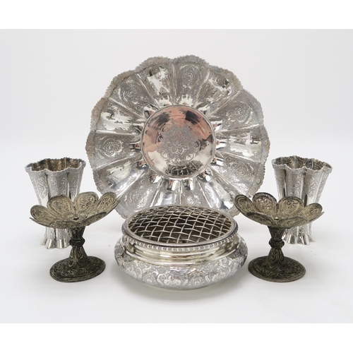 2488 - A PERSIAN SILVER FOOTED DISHof lobed form, the well decorated with a central floral medallion, the b... 