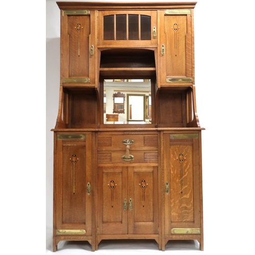 2009 - AN AUSTRIAN SECESSION STYLE OAK SIDEBOARD with moulded cornice over central bevelled glass door and ... 