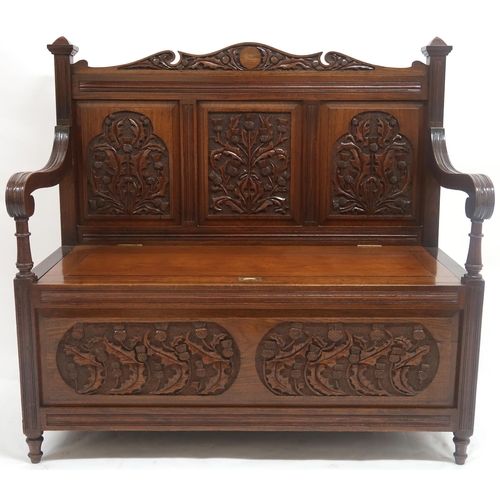 2019 - AN EARLY 20TH CENTURY SCOTTISH HALL SETTLE with three panel back rest carved with thistle motifs fla... 