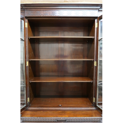 2035 - AN EARLY 20TH CENTURY MAHOGANY BREAKFRONT BOOKCASE with moulded cornice over pair of beaded glazed d... 