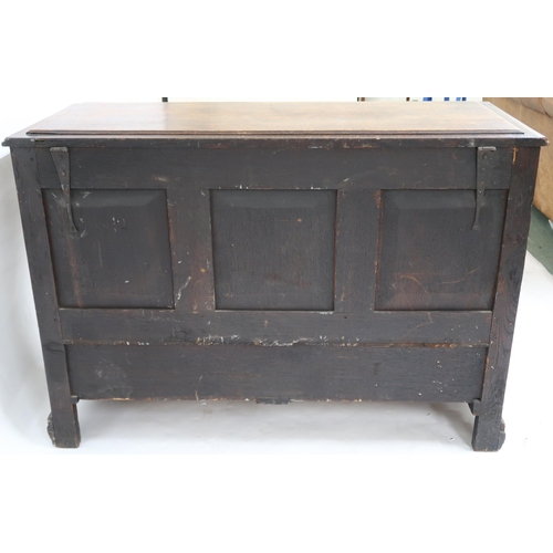 2045 - AN 18TH CENTURY OAK BLANKET CHEST with stepped hinged top containing candle box and three short inte... 