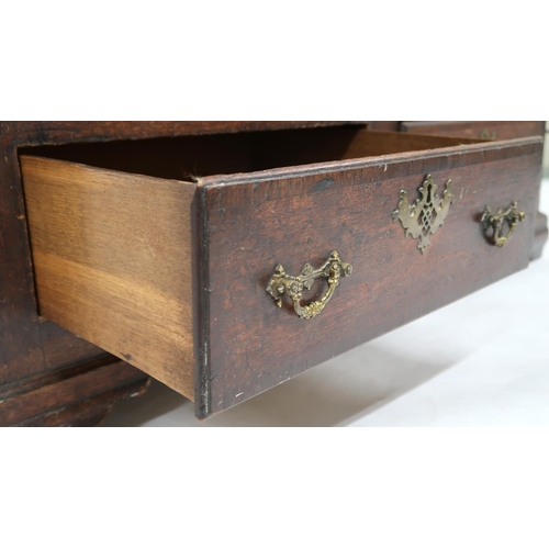 2045 - AN 18TH CENTURY OAK BLANKET CHEST with stepped hinged top containing candle box and three short inte... 