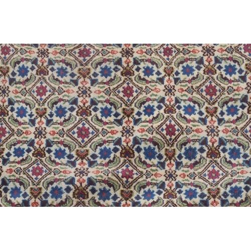 2135 - A MULTICOLOURED PATTERNED GROUND TABRIZ RUG with red patterned border, 304cm long x 214cm wide... 