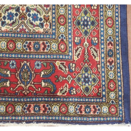 2135 - A MULTICOLOURED PATTERNED GROUND TABRIZ RUG with red patterned border, 304cm long x 214cm wide... 