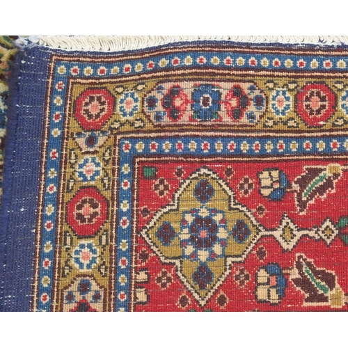 2135 - A MULTICOLOURED PATTERNED GROUND TABRIZ RUG with red patterned border, 304cm long x 214cm wide... 