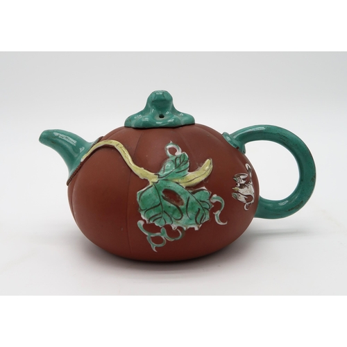 2370 - A CHINESE YIXING TEAPOTof gourd form, decorated and enamelled in relief with foliage and birds, 19.2... 