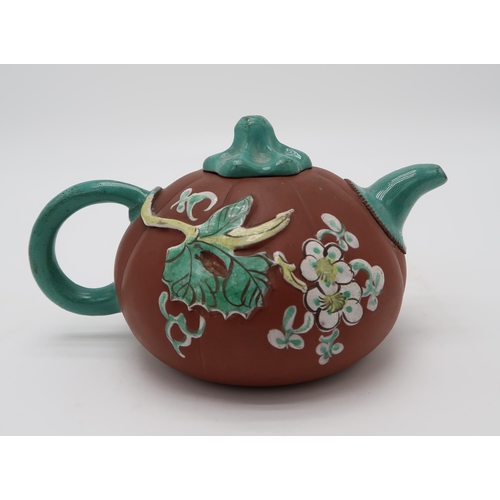 2370 - A CHINESE YIXING TEAPOTof gourd form, decorated and enamelled in relief with foliage and birds, 19.2... 