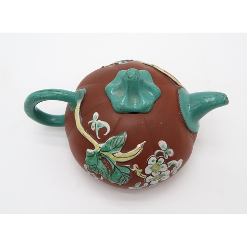 2370 - A CHINESE YIXING TEAPOTof gourd form, decorated and enamelled in relief with foliage and birds, 19.2... 