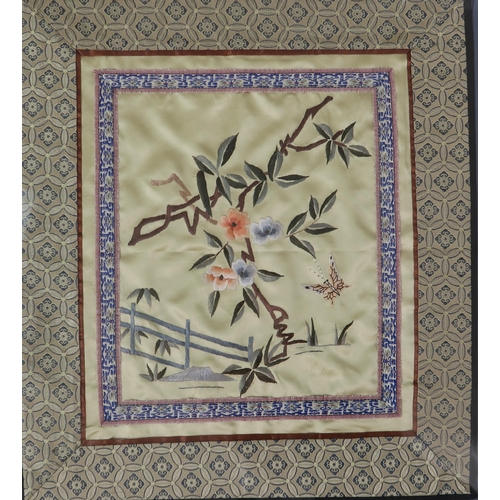 2372 - A PAIR OF CHINESE SILK PANELSembroidered with butterflies and foliage, surrounded by a diaper border... 