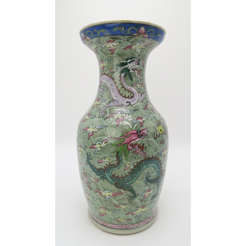 2374 - A CHINESE CELADON GROUND FAMILLE ROSE BALUSTER VASEdecorated with dragons amongst clouds and waves c... 